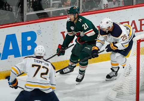 ST. PAUL, MN – NOVEMBER 17: Eric Fehr #21 of the Minnesota Wild skates with the puck as Tage Thompson #72 of the Buffalo Sabres and Jason Pominville #29 of the Buffalo Sabres defend during a game at Xcel Energy Center on November 17, 2018 in St. Paul, Minnesota.(Photo by Bruce Kluckhohn/NHLI via Getty Images)