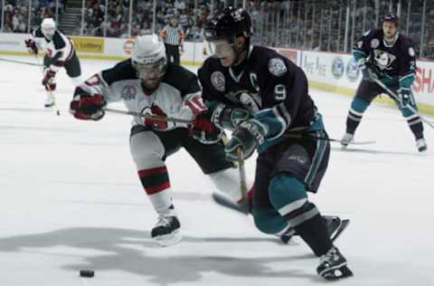 EAST RUTHERFORD, NJ – MAY 29: Oleg Tverdovsky #10 of the New Jersey Devils faces off against Paul Kariya #9 of the Mighty Ducks of Anaheim in game two of the 2003 Stanley Cup Finals. (Photo by Al Bello/Getty Images/NHLI)