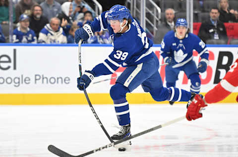 Oct 5, 2023; Toronto, Ontario, CAN; Toronto Maple Leafs forward Fraser Minten (39) shoots the puck against the Detroit Red Wings in the first period at Scotiabank Arena. Mandatory Credit: Dan Hamilton-USA TODAY Sports