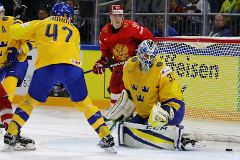 COPENHAGEN, DENMARK – MAY 15, 2018: Sweden’s Hampus Lindholm, goalie Anders Nilsson (L-R front), and Russia’s Nikita Gusev (back) in action in their 2018 IIHF World Championship Preliminary Round Group A ice hockey match at Royal Arena. Alexander Demianchuk/TASS (Photo by Alexander DemianchukTASS via Getty Images)