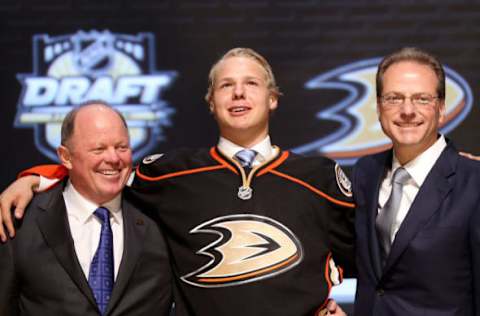 PITTSBURGH, PA – JUNE 22: Hampus Lindholmli, sixth overall pick by the Anaheim Ducks, poses on stage with Ducks representatives during Round One of the 2012 NHL Entry Draft at Consol Energy Center on June 22, 2012 in Pittsburgh, Pennsylvania. (Photo by Bruce Bennett/Getty Images)