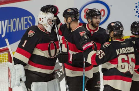 Nov 3, 2016; Ottawa, Ontario, CAN; Ottawa Senators goalie Mike Condon (1) celebrates with teammates after defeating the Vancouver Canucks 1-0 in a shutout at the Canadian Tire Centre. Mandatory Credit: Marc DesRosiers-USA TODAY Sports