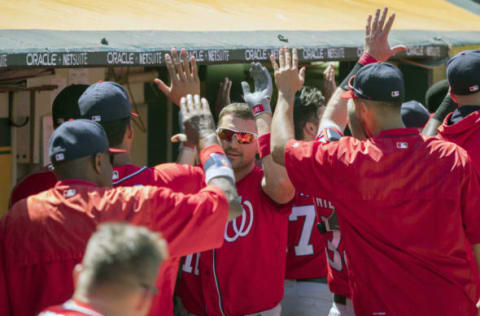 Jun 4, 2017; Oakland, CA, USA; Washington Nationals designated hitter Ryan Zimmerman (11) is congratulated by teammates in the dugout during the eighth inning after hitting a three run homer against the Oakland Athletics at Oakland Coliseum. Mandatory Credit: Neville E. Guard-USA TODAY Sports