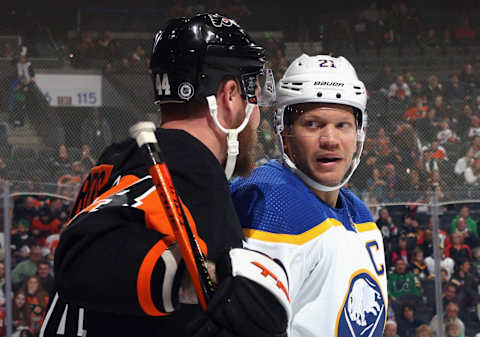 PHILADELPHIA, PENNSYLVANIA – MARCH 17: Nicolas Deslauriers #44 of the Philadelphia Flyers and Kyle Okposo #21 of the Buffalo Sabres chat during the third period at the Wells Fargo Center on March 17, 2023 in Philadelphia, Pennsylvania. The Flyers defeated the Sabres 5-2. (Photo by Bruce Bennett/Getty Images)