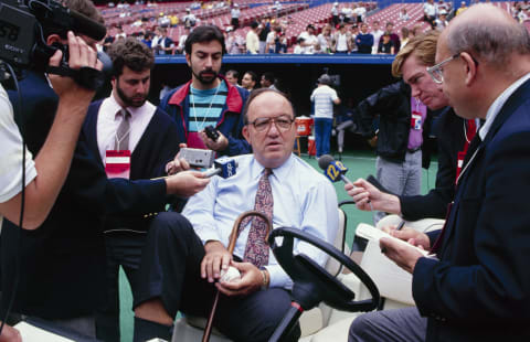 PITTSBURGH – OCTOBER 1990: MLB Commissioner Fay Vincent speaks to reporters before a game in the 1990 NLCS between the Cincinnati Reds and Pittsburgh Pirates at Three Rivers Stadium in October 1990 in Pittsburgh, Pennsylvania. (Photo by Jim Commentucci/Getty Images)