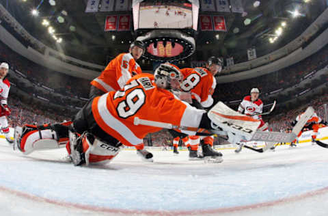 PHILADELPHIA, PA – APRIL 06: Carter Hart #79 of the Philadelphia Flyers dives across his crease as Samuel Morin #5 and Ryan Hartman #38 look back into the net against the Carolina Hurricanes on April 6, 2019 at the Wells Fargo Center in Philadelphia, Pennsylvania. The Hurricanes went on to defeat the Flyers 4-3. Tonight’s game is the last of the Flyers’ season. (Photo by Len Redkoles/NHLI via Getty Images)