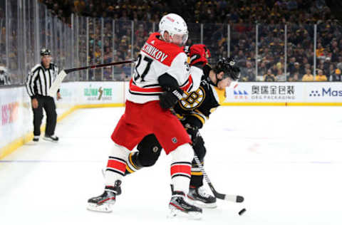 BOSTON, MASSACHUSETTS – MAY 09: Andrei Svechnikov #37 of the Carolina Hurricanes battles for the puck with Torey Krug #47 of the Boston Bruins during the first period in Game One of the Eastern Conference Final during the 2019 NHL Stanley Cup Playoffs at TD Garden on May 09, 2019 in Boston, Massachusetts. (Photo by Bruce Bennett/Getty Images)