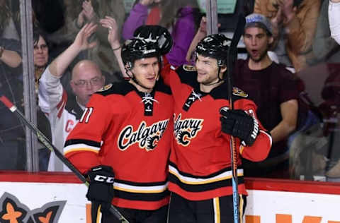 Mar 11, 2016; Calgary, Alberta, CAN; Calgary Flames center Mikael Backlund (11) celebrates his second period goal with right wing Michael Frolik (67) against the Arizona Coyotes at Scotiabank Saddledome. Mandatory Credit: Candice Ward-USA TODAY Sports