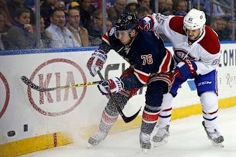 Feb 21, 2017; New York, NY, USA; New York Rangers defenseman Brady Skjei (76) battles for the puck with Montreal Canadiens center Andrew Shaw (65) during the first period at Madison Square Garden. Mandatory Credit: Adam Hunger-USA TODAY Sports