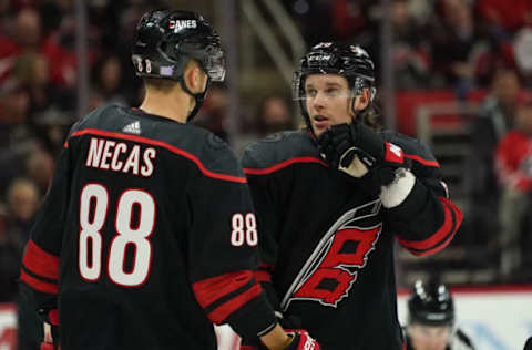 RALEIGH, NC – NOVEMBER 01: Carolina Hurricanes Center Erik Haula (56) talks with Carolina Hurricanes Right Wing Martin Necas (88) during a game between the Detroit Red Wings and the Carolina Hurricanes on November 1, 2019 at the PNC Arena in Raleigh, NC. (Photo by Greg Thompson/Icon Sportswire via Getty Images)