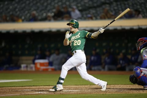 OAKLAND, CA – AUGUST 6: Mark Canha #20 of the Oakland Athletics bats during the game against the Texas Rangers at RingCentral Coliseum on August 6, 2021 in Oakland, California. The Athletics defeated the Rangers 4-1. (Photo by Michael Zagaris/Oakland Athletics/Getty Images)