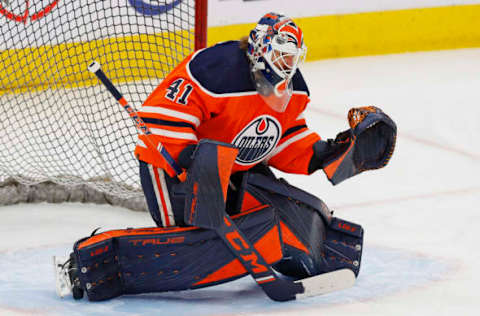 Apr 16, 2022; Edmonton, Alberta, CAN; Edmonton Oilers goaltender Mike Smith (41) makes a save during warmup against the Vegas Golden Knights at Rogers Place. Mandatory Credit: Perry Nelson-USA TODAY Sports