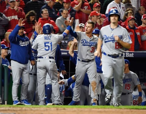 Oct 13, 2016; Washington, DC, USA; Los Angeles Dodgers catcher Carlos Ruiz (51) celebrates with his team after scoring during the seventh inning against the Washington Nationals during game five of the 2016 NLDS playoff baseball game at Nationals Park. Mandatory Credit: Brad Mills-USA TODAY Sports