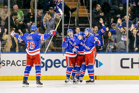 NEW YORK, NY – MARCH 14: Rangers players celebrate goal with fans during the Pittsburgh Penguins and New York Rangers NHL game on March 14, 2018, at Madison Square Garden in New York, NY. (Photo by John Crouch/Icon Sportswire via Getty Images)