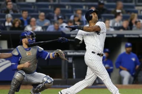 May 2, 2017; Bronx, NY, USA; New York Yankees right fielder Aaron Hicks (31) follows through on a home run against the Toronto Blue Jays in the first inning at Yankee Stadium. Mandatory Credit: Noah K. Murray-USA TODAY Sports