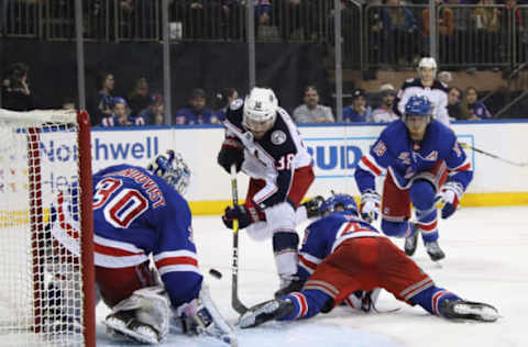 NEW YORK, NEW YORK – DECEMBER 27: Henrik Lundqvist #30 of the New York Rangers stops Boone Jenner #38 of the Columbus Blue Jackets during the third period at Madison Square Garden on December 27, 2018 in New York City. The Blue Jackets defeated the Rangers 3-2 in overtime. (Photo by Bruce Bennett/Getty Images)