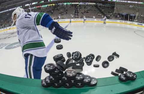 Nov 27, 2015; Dallas, TX, USA; Vancouver Canucks right wing Radim Vrbata (17) throws pucks on the ice prior to the game against the Dallas Stars at the American Airlines Center. Mandatory Credit: Jerome Miron-USA TODAY Sports