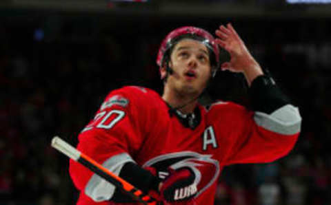 Apr 11, 2023; Raleigh, North Carolina, USA; Carolina Hurricanes center Sebastian Aho (20) looks up at the fans after their victory against the Detroit Red Wings at PNC Arena. Mandatory Credit: James Guillory-USA TODAY Sports