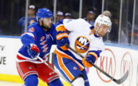 Sep 27, 2016; New York, NY, USA; New York Rangers right wing Nicklas Jensen (39) and New York Islanders defenseman calvin de Haan (44) come together during the first period during a preseason hockey game at Madison Square Garden. Mandatory Credit: Andy Marlin-USA TODAY Sports