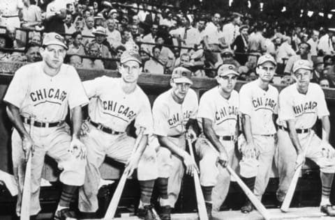 CHICAGO, IL – OCTOBER 6, 1945. A group of Chicago Cubs pose in their dugout in Wrigley Field on October 6 before the start of game four of the 1945 World Series. These Cubs are (L-R) Swish Nicholson, Andy Pafko, Phil Cavaretta, Peanuts Lowrey, Don Johnson, and Stan Hack. (Photo by The Rucker Archive/Icon Sportswire via Getty Images)