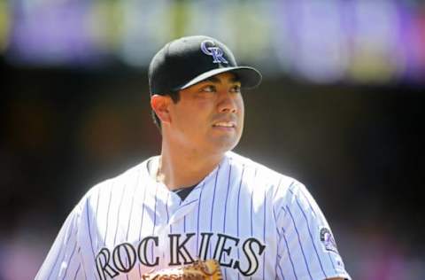 Jul 22, 2015; Denver, CO, USA; Colorado Rockies starting pitcher Jorge De La Rosa (29) walks off the field during the fifth inning against the Texas Rangers at Coors Field. The Rangers won 10-8. Mandatory Credit: Chris Humphreys-USA TODAY Sports