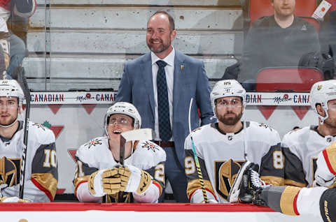 OTTAWA, ON – JANUARY 16: Head coach Peter DeBoer of the Vegas Golden Knights smiles form behind the bench before an NHL game against the Ottawa Senators at Canadian Tire Centre on January 16, 2020 in Ottawa, Ontario, Canada. (Photo by Andre Ringuette/NHLI via Getty Images)