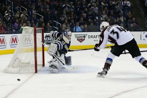 Jan 16, 2016; Columbus, OH, USA; Columbus Blue Jackets goalie Joonas Korpisalo (70) makes a save against Colorado Avalanche center Carl Soderberg (34) during the first period at Nationwide Arena. Mandatory Credit: Russell LaBounty-USA TODAY Sports