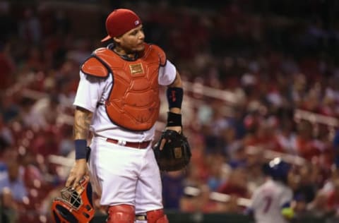 Aug 23, 2016; St. Louis, MO, USA; St. Louis Cardinals catcher Yadier Molina (4) reacts after New York Mets third baseman Jose Reyes (7) scored during the ninth inning at Busch Stadium. The Mets won 7-4. Mandatory Credit: Jeff Curry-USA TODAY Sports