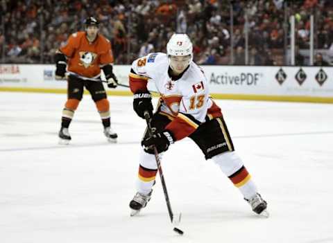 Feb 21, 2016; Anaheim, CA, USA; Calgary Flames left wing Johnny Gaudreau (13) moves the puck down the ice during the first period against the Anaheim Ducks at Honda Center. Mandatory Credit: Kelvin Kuo-USA TODAY Sports