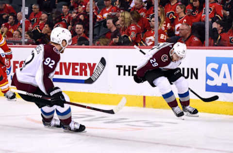 CALGARY, AB – APRIL 13: Colorado Avalanche Center Nathan MacKinnon (29) celebrates with Left Wing Gabriel Landeskog (92) after scoring the winning goal during the first overtime period of Game Two of the Western Conference First Round during the 2019 Stanley Cup Playoffs where the Calgary Flames hosted the Colorado Avalanche on April 13, 2019, at the Scotiabank Saddledome in Calgary, AB. (Photo by Brett Holmes/Icon Sportswire via Getty Images)