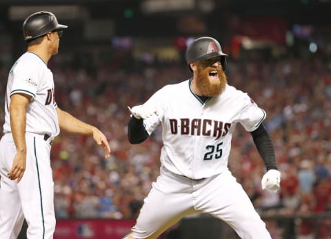 Oct 4, 2017; Phoenix, AZ, USA; Arizona Diamondbacks relief pitcher Archie Bradley (25) celebrates a triple, driving in two runs, against the Colorado Rockies during the seventh inning in the 2017 National League wildcard playoff baseball game at Chase Field. Mandatory Credit: Michael Chow/The Arizona Republic via USA TODAY NETWORK