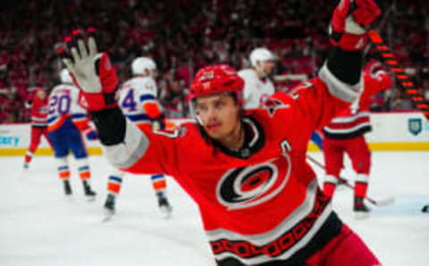 Apr 25, 2023; Raleigh, North Carolina, USA; Carolina Hurricanes center Sebastian Aho (20) celebrates his goal against the New York Islanders during the third period in game five of the first round of the 2023 Stanley Cup Playoffs at PNC Arena. Mandatory Credit: James Guillory-USA TODAY Sports