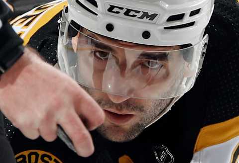 ELMONT, NEW YORK – JANUARY 18: Patrice Bergeron #37 of the Boston Bruins waits for the puck drop during the first period against the New York Islanders at UBS Arena on January 18, 2023, in Belmont, New York. (Photo by Bruce Bennett/Getty Images)