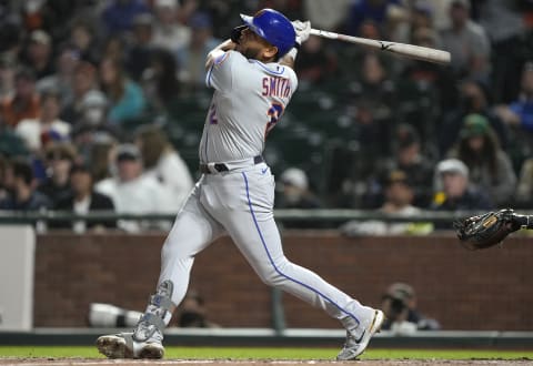 SAN FRANCISCO, CALIFORNIA – AUGUST 16: Dominic Smith #2 of the New York Mets hits a sacrifice fly scoring Pete Alonso #20 against the San Francisco Giants in the top of the fifth inning at Oracle Park on August 16, 2021 in San Francisco, California. (Photo by Thearon W. Henderson/Getty Images)