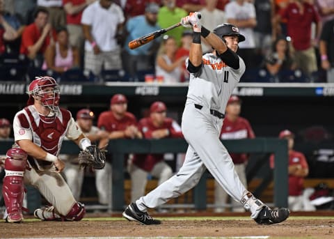 Omaha, NE – JUNE 27: Outfielder Trevor Larnach #11 of the Oregon State Beavers hits a two run home run to give the Beavers a 5-3 lead in the ninth inning against the Arkansas Razorbacks during game two of the College World Series Championship Series on June 27, 2018 at TD Ameritrade Park in Omaha, Nebraska. (Photo by Peter Aiken/Getty Images)