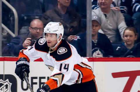 WINNIPEG, MB: Adam Henrique #14 of the Anaheim Ducks follows the play up ice during first-period action against the Winnipeg Jets on March 23, 2018. The Jets defeated the Ducks 3-2 in overtime. (Photo by Jonathan Kozub/NHLI via Getty Images)