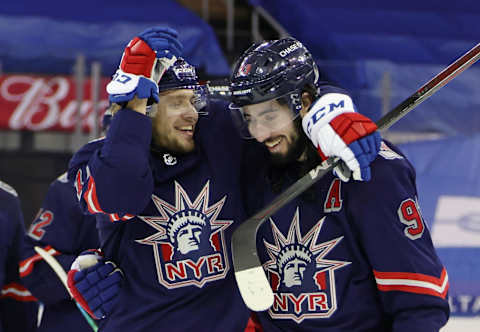 New York Rangers left wing Artemi Panarin (left) and center Mika Zibanejad (93) celebrate . Mandatory Credit: Bruce Bennett/Pool Photo-USA TODAY Sports