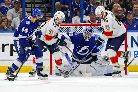 TAMPA, FL – MAY 23: Andrei Vasilevskiy #88 of the Tampa Bay Lightning makes a save against Sam Reinhart #13 and Aleksander Barkov #16 of the Florida Panthers as Jan Rutta #44 defends during the second period in Game Four of the Second Round of the 2022 Stanley Cup Playoffs at Amalie Arena on May 23, 2022 in Tampa, Florida. (Photo by Mike Carlson/Getty Images)