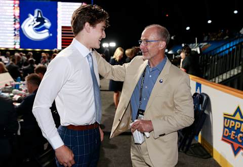 NASHVILLE, TENNESSEE – JUNE 29: Gavin Mccarthy talks with head coach Don Granato after being selected 86th overall by the Buffalo Sabres during the 2023 Upper Deck NHL Draft – Rounds 2-7 at Bridgestone Arena on June 29, 2023 in Nashville, Tennessee. (Photo by Jeff Vinnick/NHLI via Getty Images)