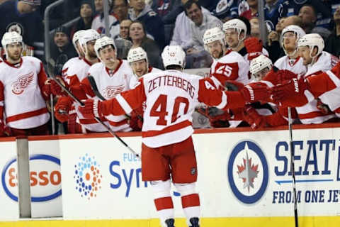 NHL Power Rankings: Detroit Red Wings left wing Henrik Zetterberg (40) celebrates his goal with teammates during the overtime period against the Winnipeg Jets at MTS Centre. Wings win 4-3 in overtime shootout. Mandatory Credit: Bruce Fedyck-USA TODAY Sports