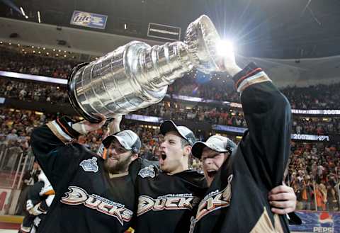 Ducks teammates from left, Dustin Penner, Ryan Getzlaf, and Corey Perry hoist the Stanley Cup after beating the Ottawa Senators in game 5. The Anaheim Ducks became the first West Coast team to win the Stanley Cup after beating the Ottawa Senators 6?2 in game five at the Honda Center in Anaheim. (Photo by Wally Skalij/Los Angeles Times via Getty Images)