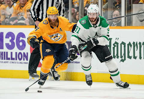 NASHVILLE, TN – APRIL 20: Tyler Seguin #91 of the Dallas Stars skates against Ryan Ellis #4 of the Nashville Predators in Game Five of the Western Conference First Round during the 2019 NHL Stanley Cup Playoffs at Bridgestone Arena on April 20, 2019 in Nashville, Tennessee. (Photo by John Russell/NHLI via Getty Images)