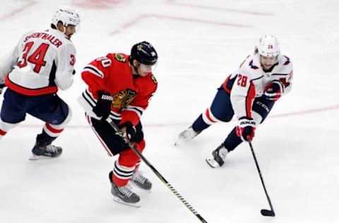 Sep 25, 2019; Chicago, IL, USA; Washington Capitals left wing Brendan Leipsic (28) defends Chicago Blackhawks left wing Brandon Saad (20) during the third period at United Center. Mandatory Credit: David Banks-USA TODAY Sports