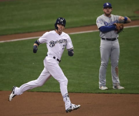 Milwaukee Brewers outfielder Christian Yelich hits a solo home run against the Los Angeles Dodgers in the first inning of Game 7. Photo via USA Today.