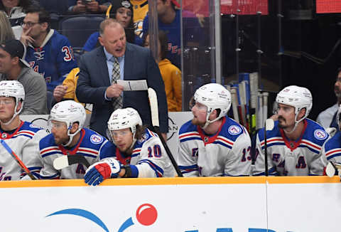 Oct 21, 2021; Nashville, Tennessee, USA; New York Rangers head coach Gerard Gallant talks with New York Rangers left wing Alexis Lafreniere (13) during the second period against the Nashville Predators at Bridgestone Arena. Mandatory Credit: Christopher Hanewinckel-USA TODAY Sports