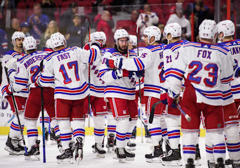 OTTAWA, ON – OCTOBER 05: New York Rangers Center Mika Zibanejad (93) is congratulated by New York Rangers Defenceman Libor Hajek (25) and team mates after scoring a hat trick in the NHL game against the Ottawa Senators on Oct. 5, 2019 at the Canadian Tire Centre in Ottawa, Ontario, Canada. (Photo by Steven Kingsman/Icon Sportswire via Getty Images)