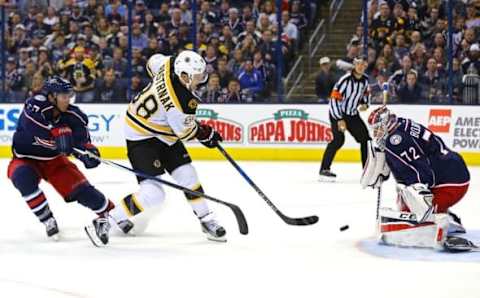 Oct 13, 2016; Columbus, OH, USA; Boston Bruins left wing David Pastrnak (88) shoots a shot against Columbus Blue Jackets defenseman Ryan Murray (27) and goalie Sergei Bobrovsky (72) in the third period at Nationwide Arena. The Bruins won 6-3. Mandatory Credit: Aaron Doster-USA TODAY Sports