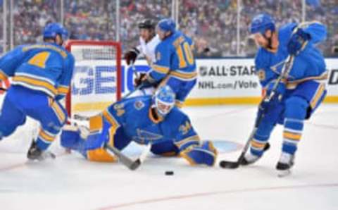 Jan 2, 2017; St. Louis, MO, USA; St. Louis Blues goalie Jake Allen (34) covers the puck against the Chicago Blackhawks during the first period in the 2016 Winter Classic ice hockey game at Busch Stadium. Mandatory Credit: Jasen Vinlove-USA TODAY Sports