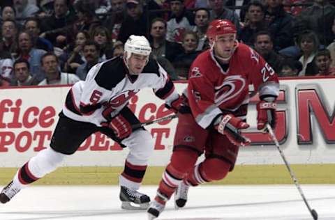 12 Apr 2001: Shane Willis #25 of the Carolina Hurricanes is chased by Sean O”Donnell #6 of the New Jersey Devils in Game 1 of the first round of the Stanley Cup playoffs at Continental Airlines Arena at the Meadowlands in East Rutherford, New Jersey. Digital Image Mandatory Credit: Jamie Squire/ALLSPORT