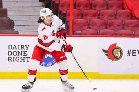 OTTAWA, ONTARIO – JANUARY 27: Ethan Bear #25 of the Carolina Hurricanes skates against the Ottawa Senators at Canadian Tire Centre on January 27, 2022, in Ottawa, Ontario. (Photo by Chris Tanouye/Getty Images)